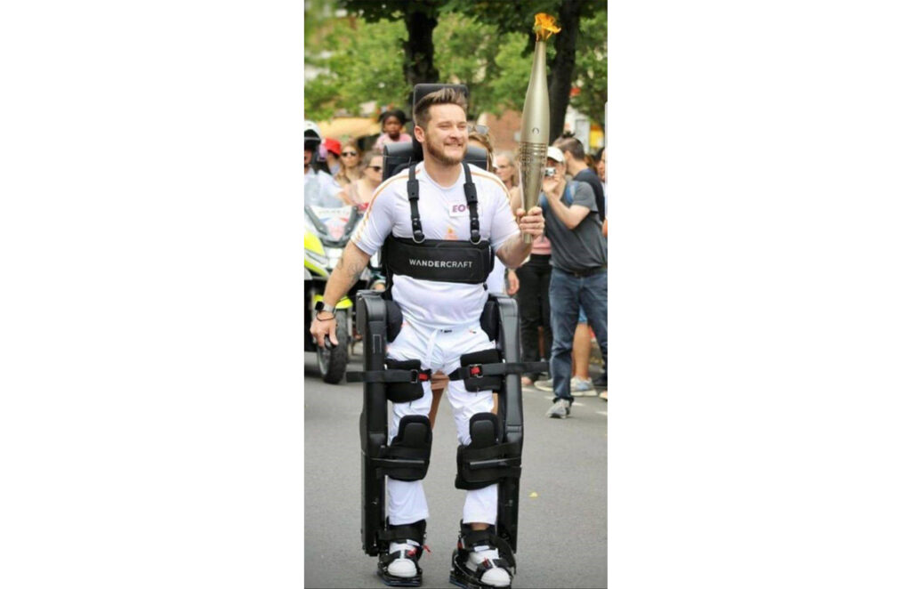 Piette became an exoskeleton pilot while holding Olympic flame.